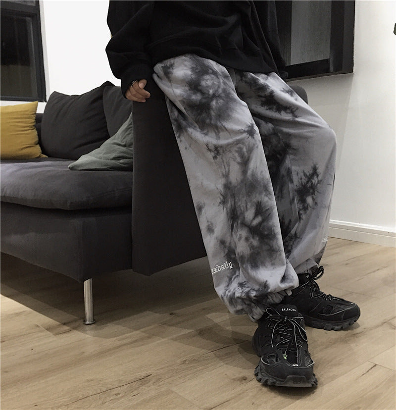 Letter-embroidered tie-dye trousers