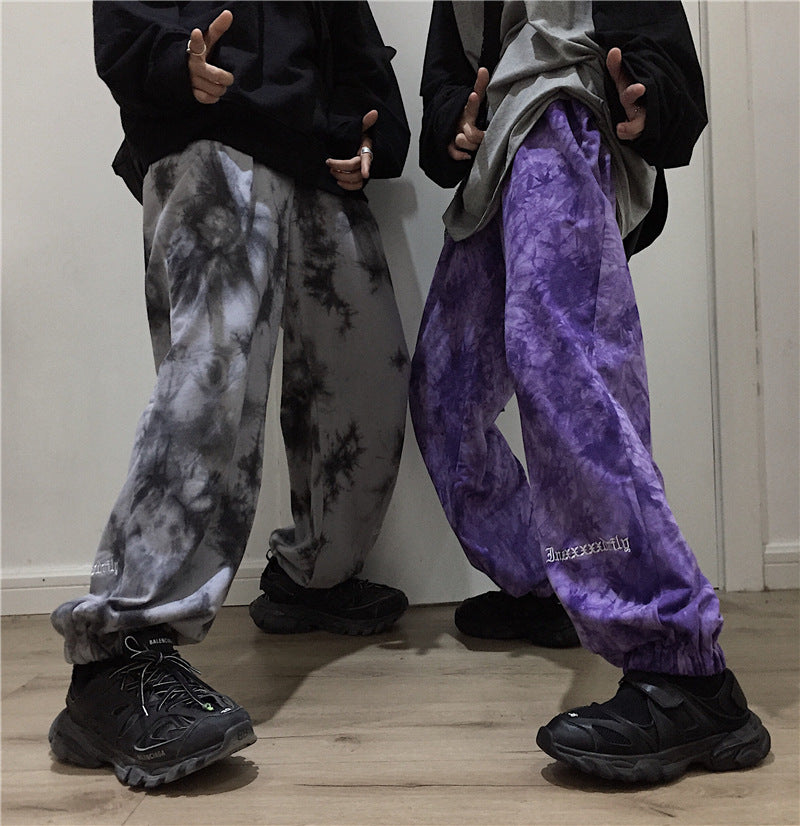 Letter-embroidered tie-dye trousers