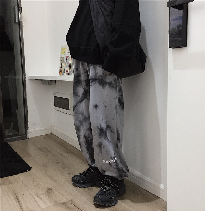 Letter-embroidered tie-dye trousers