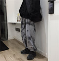 Letter-embroidered tie-dye trousers